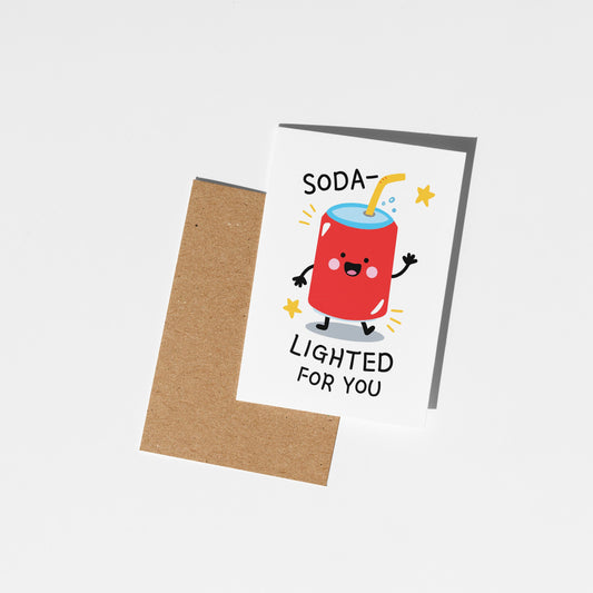 Greeting card with a cartoon soda can and text 'Soda Lighted for You' on a white background.