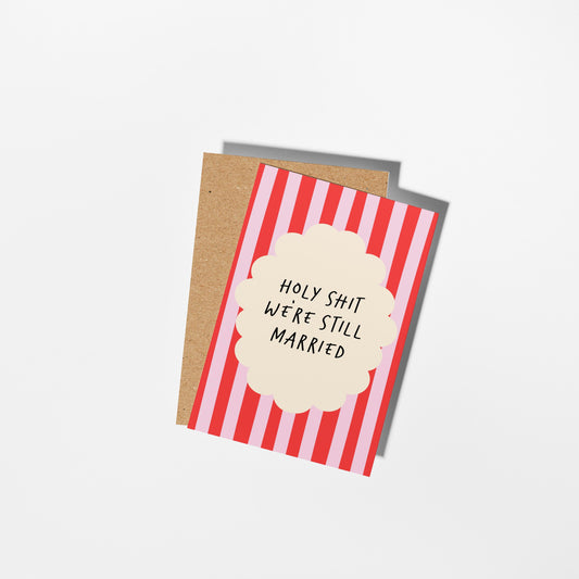 Card with red and white striped design and text on a white background