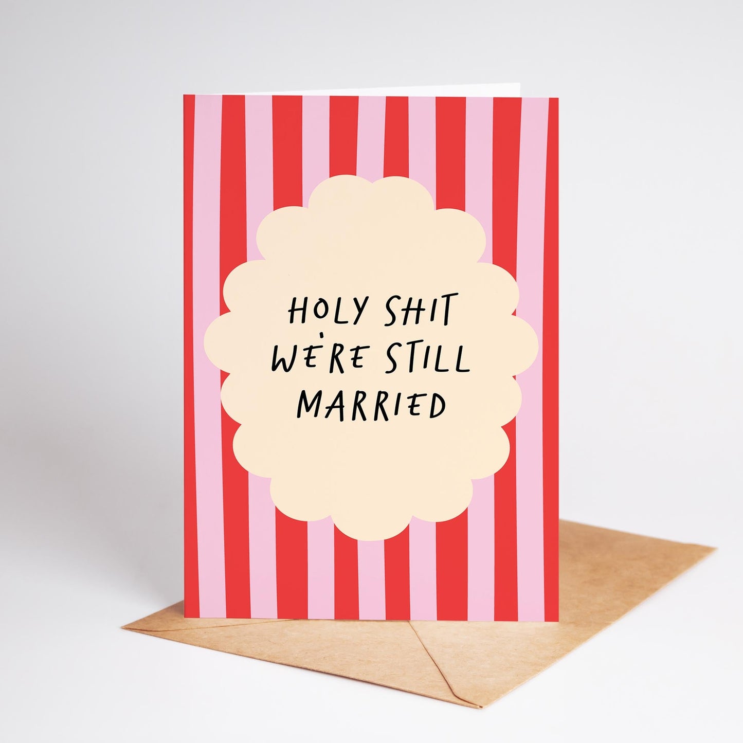 Card with red and white striped design and humorous text on a plain background