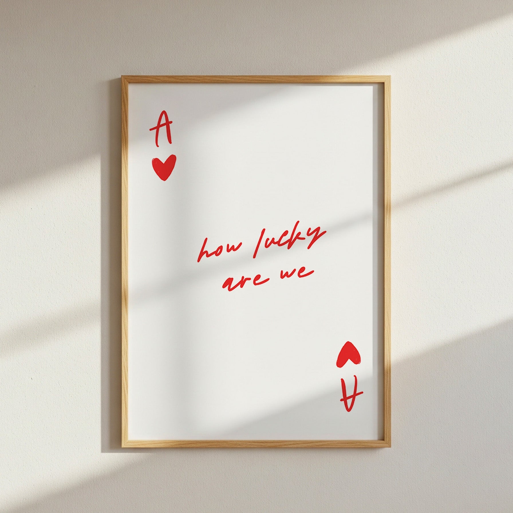 a of hearts style wall art with quote "how lucky are we" in the centre
