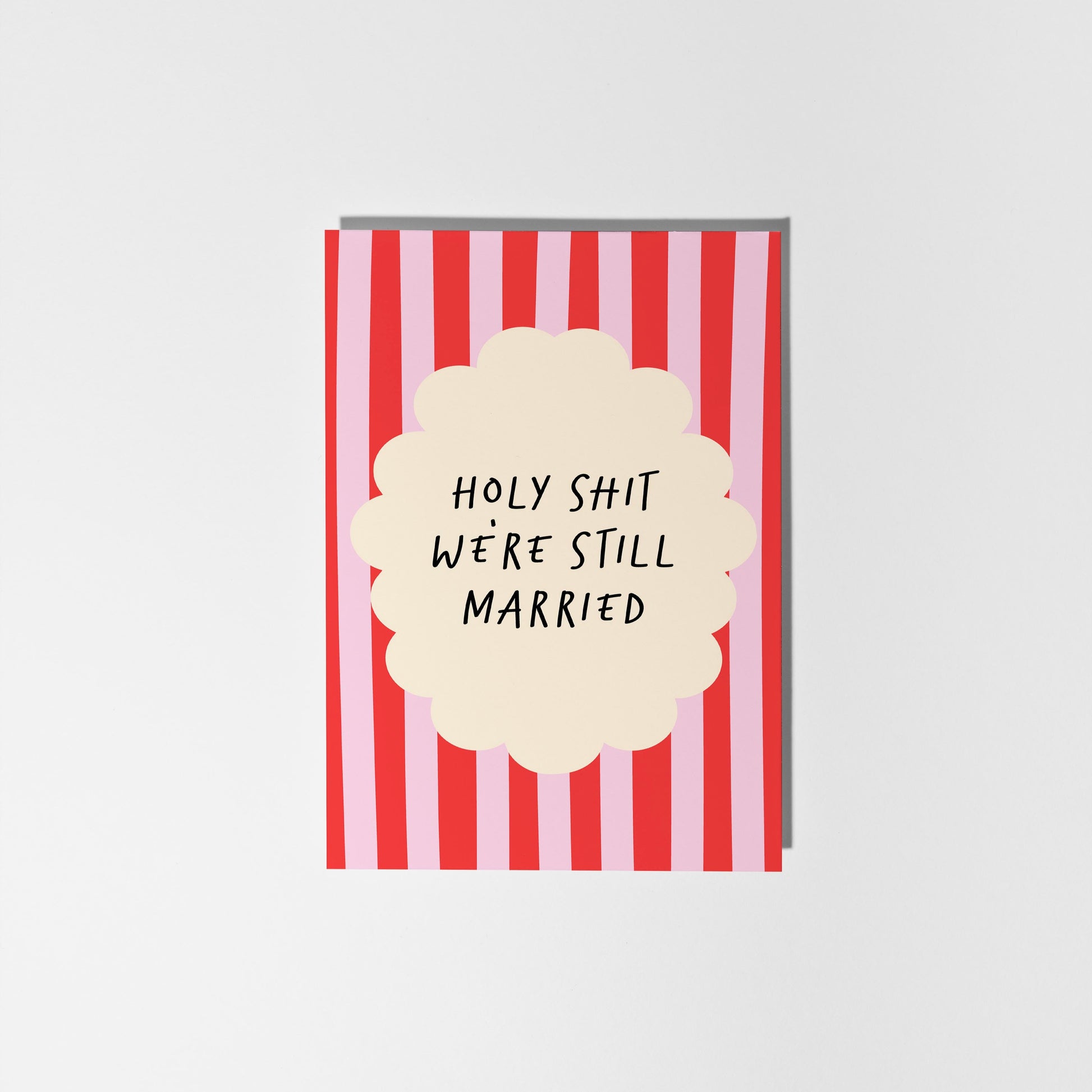 Card with red and white striped design and text 'HOLY SHIT WE'RE STILL MARRIED' on a white background