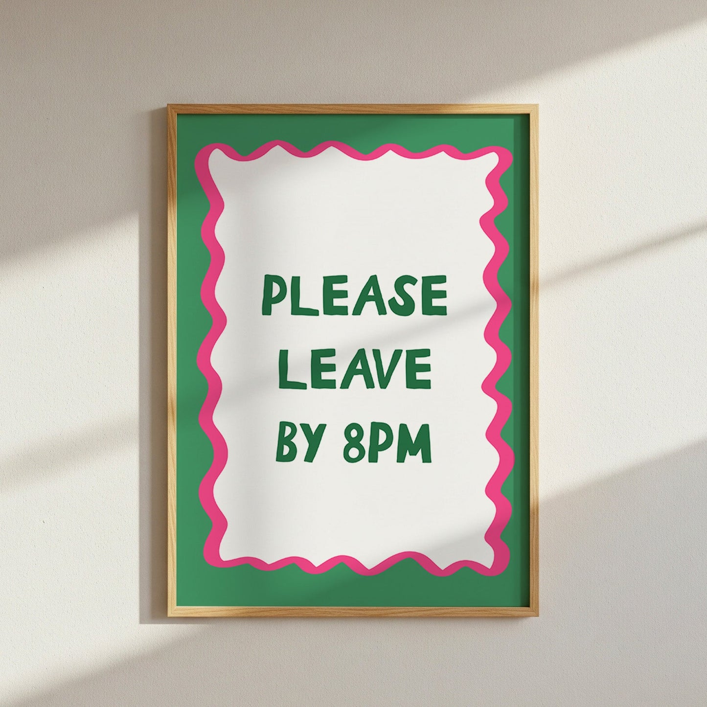 Framed sign with 'Please Leave by 8PM' text on a white wall.