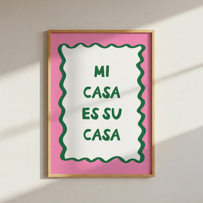 Framed poster with 'MI CASA ES SU CASA' text on a pink background